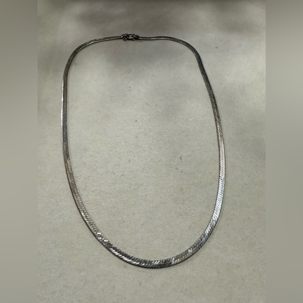 Sterling silver 17.5” herringbone chain.